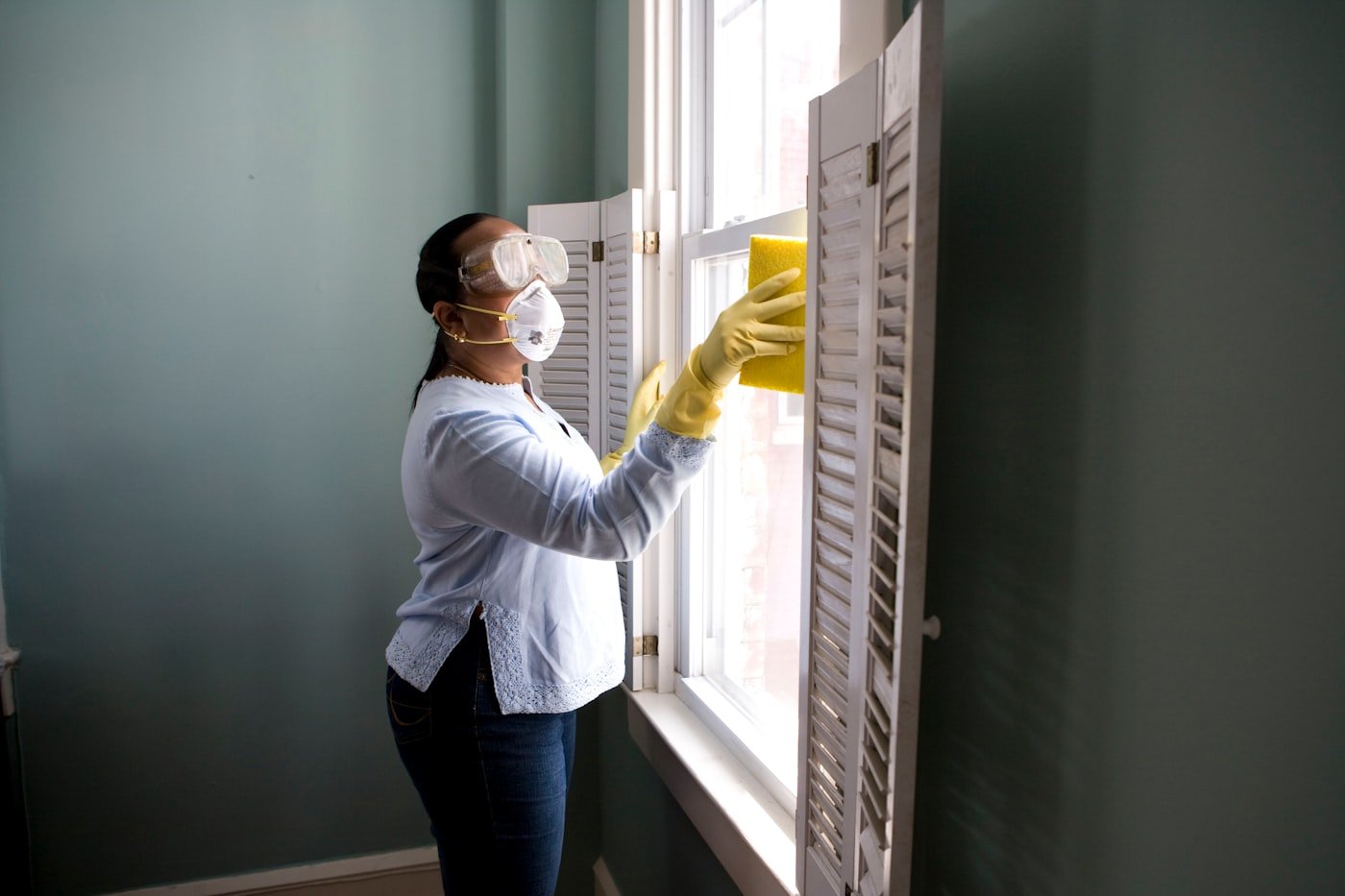 Cleaner gently cleaning a home for an NDIS participant